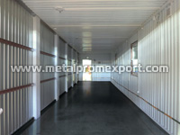 Connected modular residential building based on all-welded container unit. One of two modules with trunking wall